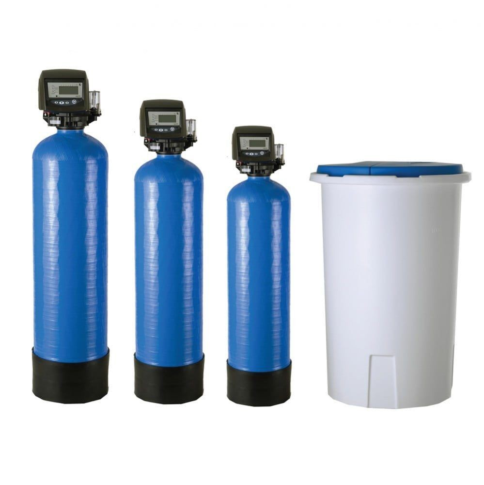Three blue water softener tanks with control valves and a white brine tank.